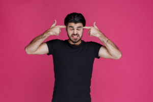 15 Tips To Stop Overthinking - Honeyview man pointing his head and overthinking about something trying to remember 1 Honeyview man pointing his head and overthinking about something trying to remember 1
